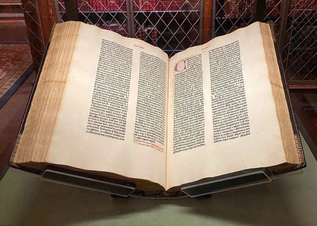 a gutenberg bible in the Morgan Library open roughly to the middle