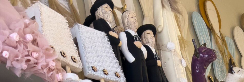 More figurines with antisemetic imagery can be seen, 3 holding a 1 zloty coin.